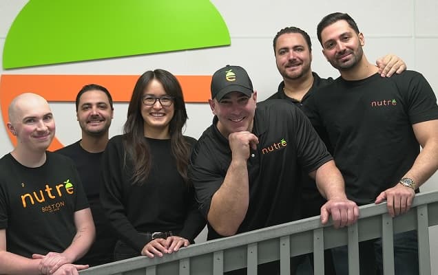 Group of diverse Nutre team members smiling.